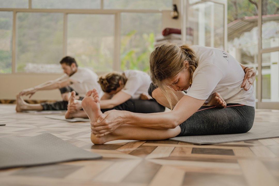 Person practicing an indoor yoga stretch for stress relief and relaxation